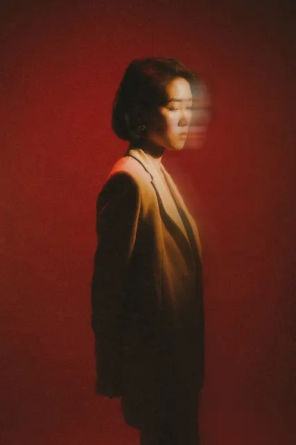 This shot masterfully blends a strong color palette with subtle motion blur to c