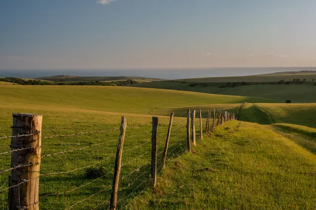 This wide landscape shot expertly uses leading lines to guide the viewer's eye a