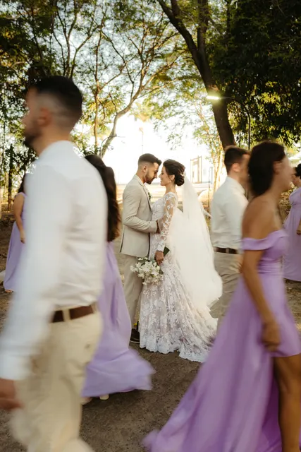 This shot masterfully isolates a newlywed couple in an intimate, joyful moment a