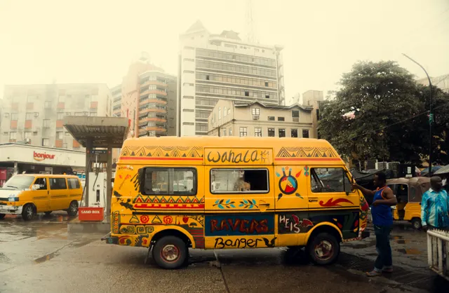 This shot captures an everyday urban scene, focusing on a brightly decorated yel
