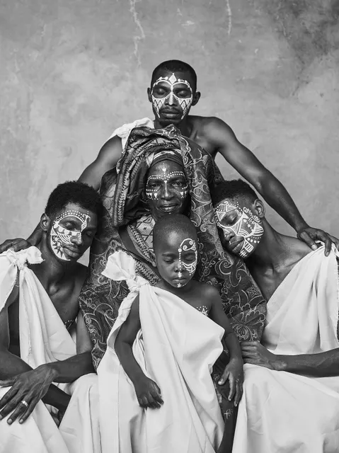 This shot is a dignified group portrait, expertly composed to highlight familial